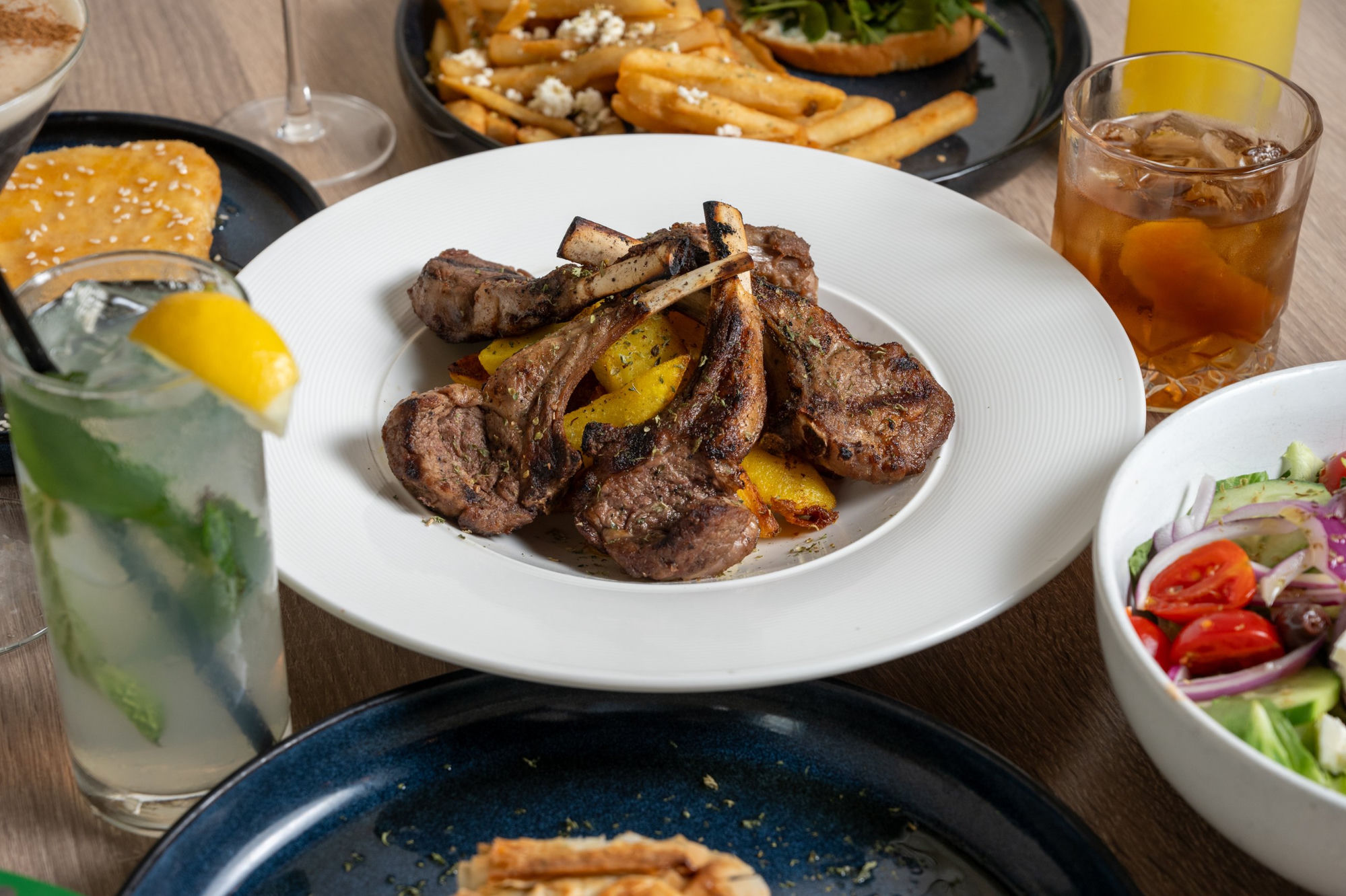 Grilled lamb chops with Greek sides and salad